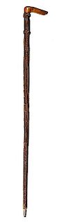 371. Folk-Art Eagle Cane – Ca. 1875 – An unusual stylized eagle with large wooden eyes, a 90% macramé and shellac woven