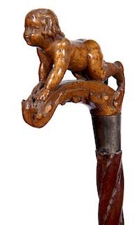 373. Naked Baby Folk-Art Cane – Ca. 1870 – A carved male child in the nude as a handle, silver metal collar “W.A.R. KRA