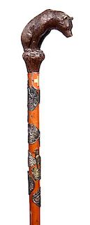 384. Carved Bear Folk-Art Cane – Ca. Early 20th Century – A nicely carved standing bear with beaded glass eyes (minor chi