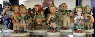 Group of fifteen Goebel Hummel figures (A Gentle Glow missing candlestick). ht. 3in. to 6 1/2in.