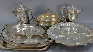 Group of silverplated items to include four large trays (lg. 17in. to 27in.), revolving center dish (lg. 20in.), covered ture