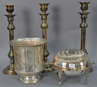 Collection of five silverplated items to include three large candlesticks (ht. 21in.), revolving tureen (ht. 9in.), and a han