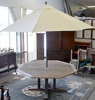 Kingsley & Bate octagon teak outdoor table with teak umbrella. ht. 29in., top: 72" x 72"