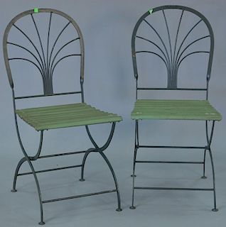 Set of nine iron and wood slat seat folding chairs, one with broken slat.