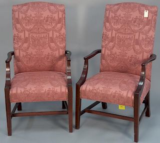 Pair of rose upholstered lolling chairs.