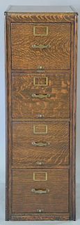 Remington Rand oak four drawer file cabinet. ht. 52in., wd. 17 1/2in., dp. 26 1/2in., drawer size: 25 1/2" x 12 3/4"