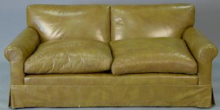 Tan leather upholstered loveseat. lg. 72in.