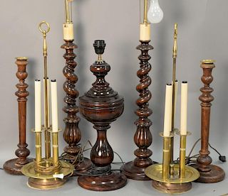 Seven table lamps to include five wood turned lamps along with a pair of brass triple candlestick lamps. ht. 18 1/2in. to 33i