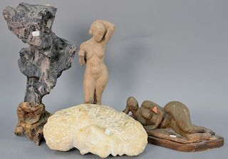 Four sculptures, stone freeform sculpture on driftwood base (ht. 16 1/2in.) two pottery nude figures (14in. & 13in.), and a m