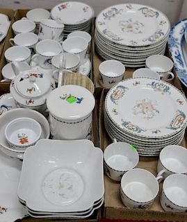 Décor Pavot by Porcelaine de Paris dinnerware set along with jars and serving pieces.