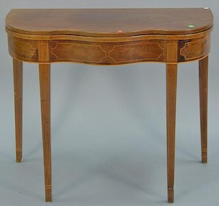 Federal style mahogany game table with serpentine front (top is loose). ht. 29in., wd. 36in.