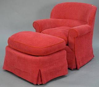 Henry Chan Furniture Co. New York, red upholstered swivel club chair with footstool and down filled cushions.