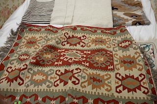 Group of seven Indian blankets and flatweave rugs.