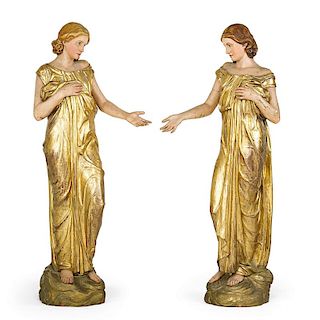 PAIR OF MONUMENTAL CARVED FEMALE FIGURES