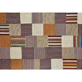 STRIP WOVEN AND PIECED RUG
