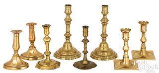 Eight brass candlesticks