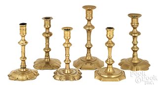 Six English Queen Anne brass candlesticks, 18th c.