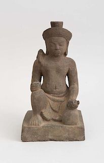 KHMER STYLE CARVED STONE ACOLYTE, 20TH CENTURY