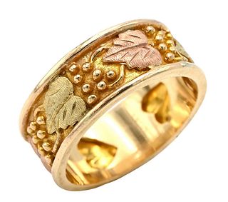 14K Yellow, Pink, and White Gold Band having Leaves and Deer Tracks Inside