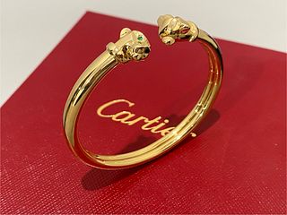 Cartier Panthere de Cartier bracelet, 18K yellow gold, tsavorite garnets, onyx, size 17.