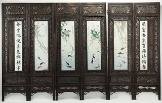 CHINESE CARVED & PIERCED HARDWOOD SIX-FOLD SCREEN WITH INSET PORCELAIN PLAQUES