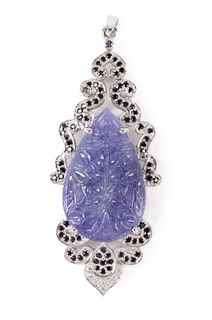 CARVED TANZANITE, STERLING, AND CRYSTAL PENDANT