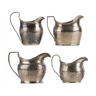A collection of Georgian Sterling Cream Pitchers