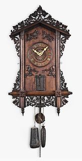 A Black Forest hanging tumpeter clock