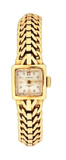 A mid 20th century lady's gold Longines wrist watch with integral bracelet