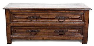 A Continental Walnut Two-Drawer Chest Height 31 x length 72 x depth 25 1/2 inches.
