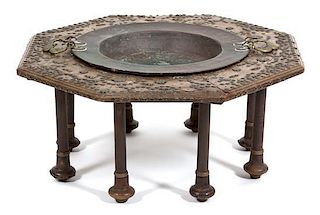 A Spanish Carved Walnut and Copper Inset Brazier Table Height 14 x diameter 33 inches.