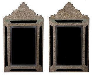 A Pair of Dutch Baroque Style Embossed Metal Mirrors Height 36 1/4 x width 20 1/2 inches.