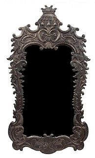 A Baroque Style Stamped Metal Mirror Height 58 x width 32 inches.