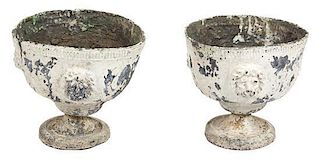 A Pair of Continental Painted Lead Urns Height 9 x diameter 9 inches.