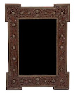 An Italian Brass Mounted Carved Oak Mirror Height 32 x width 24 inches.