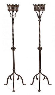 A Pair of Gothic Style Ironwork Torchieres Height 66 inches.