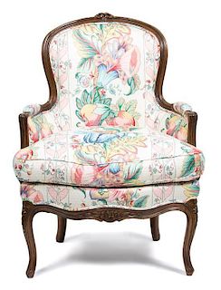 A Louis XV Style Upholstered Bergere Height 36 x width 26 x depth 27 inches.