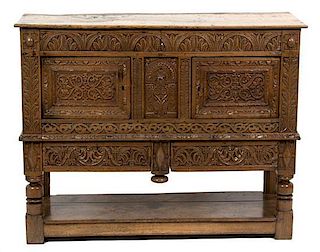 A Renaissance Revival Carved Oak Side Cabinet Height 40 x width 50 x depth 18 1/4 inches.
