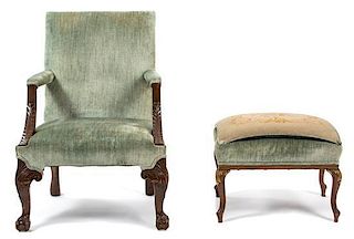 A George II Style Carved Mahogany Library Chair and Ottoman Height of first 37 x width 27 x depth 25 inches.
