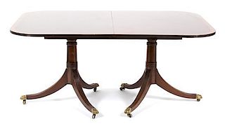 A Georgian Style Pedestal Dining Table Height 37 x width closed 66 1/4 x depth 21 3/4 inches.