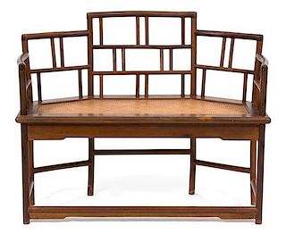 A Chinese Hardwood and Rattan Bench Height 34 x width 44 x depth 20 inches.