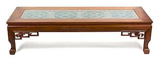 A Chinese Carved Teak Coffee Table Height 16 x width 63 3/4 x depth 23 1/2 inches.