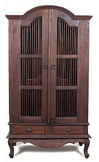 A Javanese Teak Two Door Cabinet Height 78 x width 40 1/2 x depth 23 inches.
