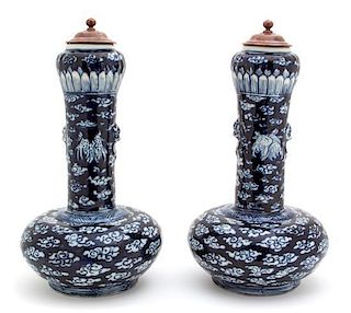 A Pair of Chinese Blue and White Garlic Head-Shaped Vases Height 13 1/2 inches.