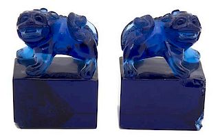 A Pair of Chinese Blue Peking Glass Foo Lions Height of lion 3 inches.