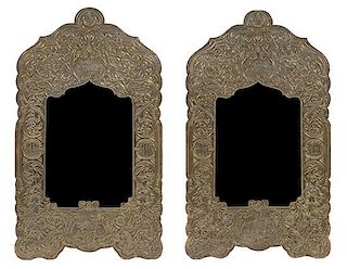 A Pair of Syrian Stamped Metal Mirrors Height 34 x width 19 1/2 inches.