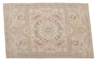 An Aubusson Style Needlepoint Rug 5 feet 8 inches x 3 feet 8 inches.
