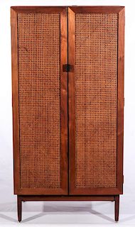 A CANED FRONT GENTLEMAN'S CHEST ATTRIBUTED KNOLL
