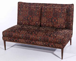 AN ARMLESS LOVE SEAT ATTRIBUTED TO PAUL MCCOBB