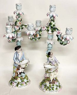 A Pair of Meissen style Figural Porcelain Candelabras